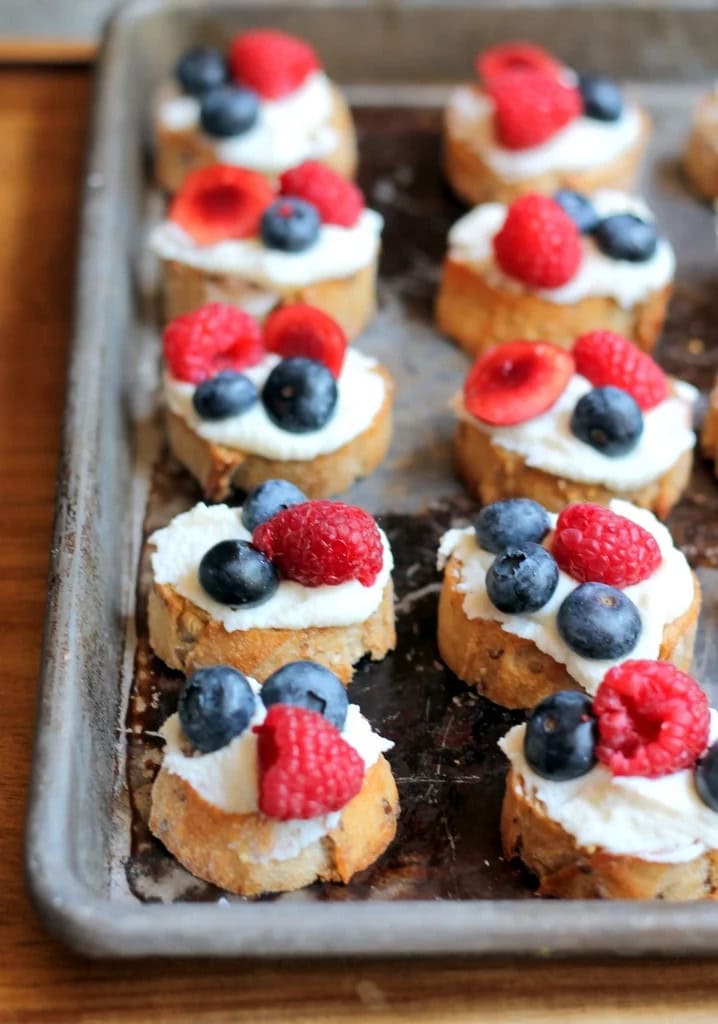 Summer Berry Crostini with Lemon Ricotta + Honey