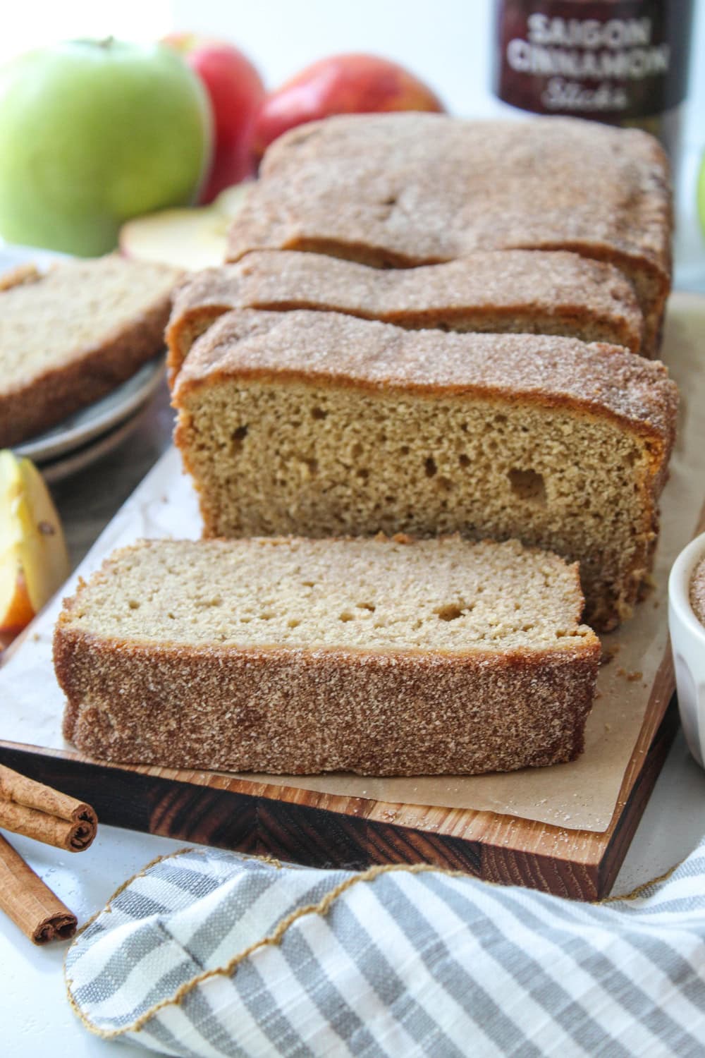 Apple cider donut bread coated in cinnamon sugar and sliced for serving